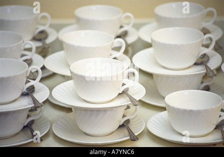 Coffee cups and saucers in stacks Stock Photo
