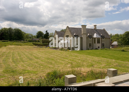 Newly built English Manor country house based on Elizabethan style of Tudor period in local Chilmark limestone, Wiltshire, England Stock Photo