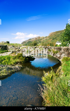Stone Packhorse Bridge Crossing Over Watendlath Beck High In The Grange Fells, Watendlath 'The Lake District' Cumbria England UK Stock Photo