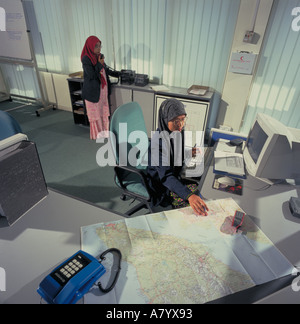 Two Malaysian office workers in Johor Bahru Malaysia SE Asia Stock Photo