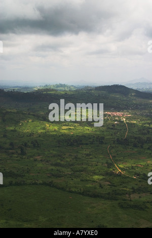 Aerial view of distant small town north of capital Accra with storm coming in and showing rural agriculture and remoteness of area, Ghana West Africa Stock Photo