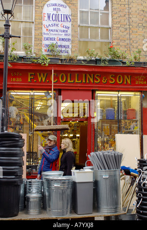 woman outside the hardware store F W Collins in Covent Garden London Stock Photo