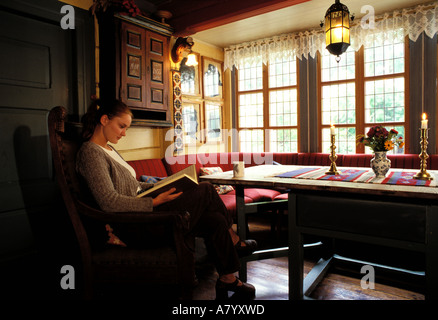 Norway, Sogn, Utne (Hardangerfjord), Utne Hotel, reading room in the kitchen Stock Photo