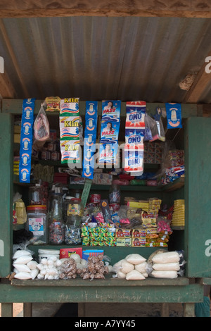 Close up detail of simple general market grocery stall and goods, made of wood with corrugated roof in Ghana West Africa Stock Photo