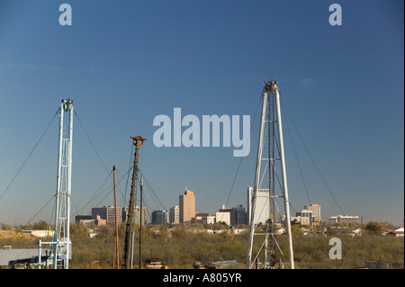 USA, TEXAS, Midland: Permian Basin Petroleum Museum Oil Drilling Machinery Display & Midland Skyline / Morning Stock Photo