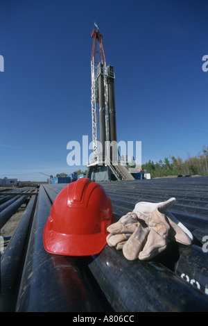 Derrick rig with hard hat and gloves Stock Photo - Alamy
