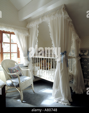 White Cotton Drapes Above Baby S Cot In Attic Nursery Bedroom With