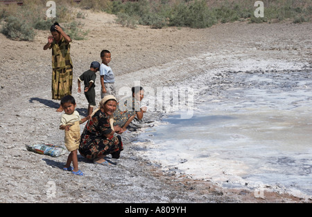 Local Villagers Collecting Salt From Pond At Aral Sea Stock Photo