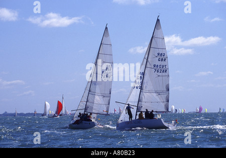Two yachts in a race in the Solent nr Cowes Isle of Wight England Great Britain