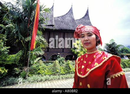 Indonesia, Sumatra island, minangkabau woman (Bukittinggi region) in front of her house
