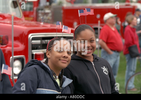 Couple age 30 applauding at Minnesota Remembers Memorial Service at state capitol for victims of 9/11. St Paul Minnesota MN USA Stock Photo