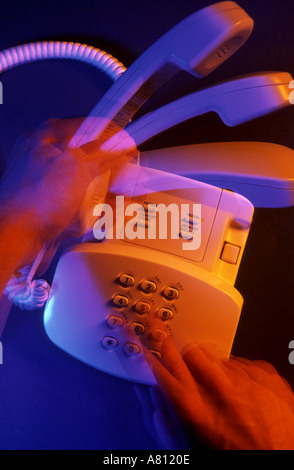 Hands picking up handset and speed dialing telephone,activity,active,access,accessibility, Stock Photo
