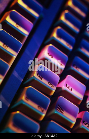 close up section of a computer keyboard with coloured lighting Stock Photo
