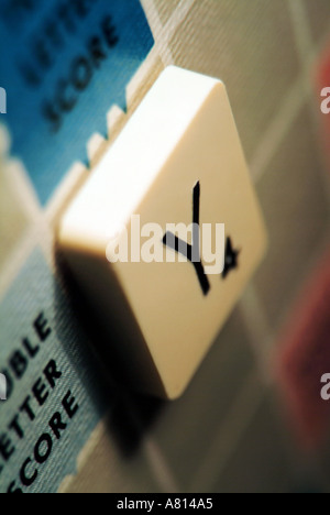 Close up of a single Scrabble tile on a Scrabble game board Stock Photo