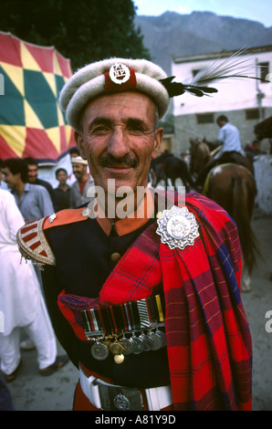 Pakistan Azad Kashmir Gilgit sport police bagpipe bandsman before polo game Stock Photo
