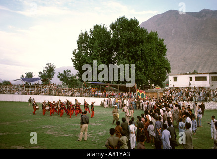 Pakistan Azad Kashmir Gilgit sport police bagpipe band performing before polo game Stock Photo