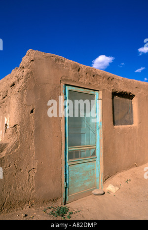 Turquoise door on an adobe house Taos Pueblo World Heritage Site New Mexico Stock Photo