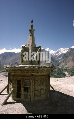 Pakistan Hunza Valley Karimabad Old wooden tower on top of Baltit fort with Karakoram mountains Stock Photo