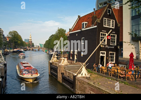 Amsterdam historic building 1695 draw bridge Cafe de Slyswacht Canal boat background Oude Schans Motelbaans Toren Stock Photo