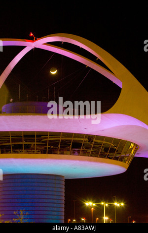 The Theme Building Encounter Restaurant at Los Angeles International Airport at night Stock Photo