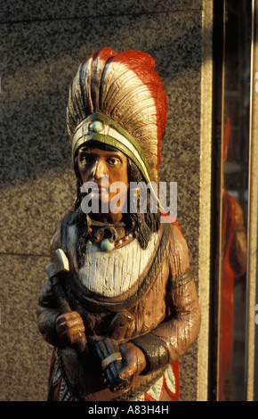 Wooden sculpture of a smoking Indian in Hamburg, Germany. Stock Photo