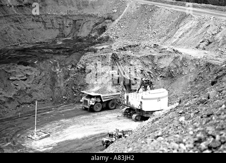 Equipment working in an open pit Coal Mine Stock Photo