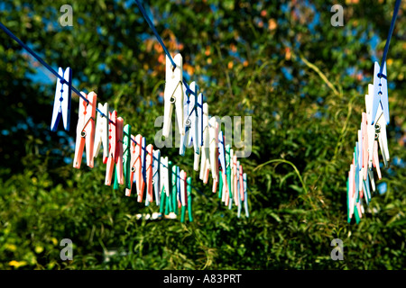 Plastic pegs on a clothes line Stock Photo