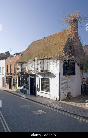 The Mint town centre street, Rye, Sussex, restaurant in foreground, manhole cover in centre of road Stock Photo