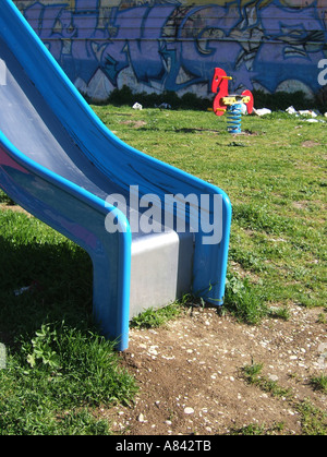 Slide And Ride In Run Down Urban Decay Playground Stock Photo Alamy