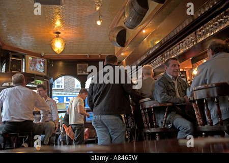 Interior shot of bar and drinkers in typical East End London pub on Brick Lane, Tower Hamlets, Whitechapel area, England Stock Photo