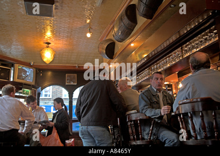 Interior shot of bar and drinkers in typical East End London pub on Brick Lane, Tower Hamlets, Whitechapel area, England Stock Photo