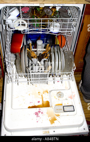 Dishwasher loaded after a party with coffee and wine drained onto the cover.  'St Paul' Minnesota USA Stock Photo