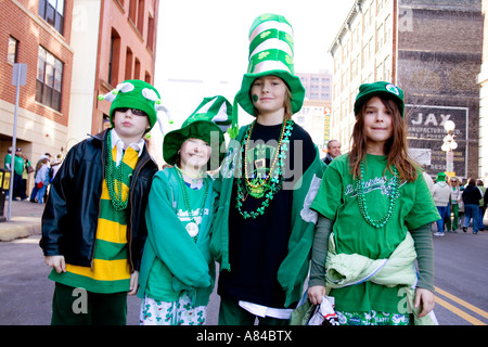 Children ages 8 through 12 dressed in St Patricks Day Parade finery downtown.  St Paul Minnesota USA Stock Photo
