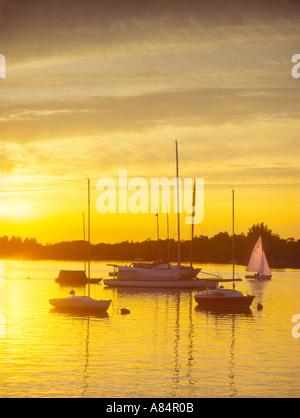 Sunset over yachts and boats at Oulton Broad near Lowestoft in Suffolk England UK Stock Photo