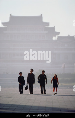 North Korea. Pyongyang. Kim Il Sung Square. Two men with children. Stock Photo