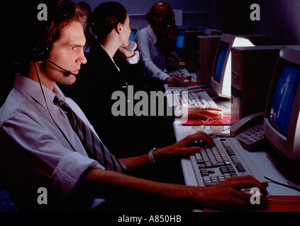 Call centre operators working at night. Stock Photo