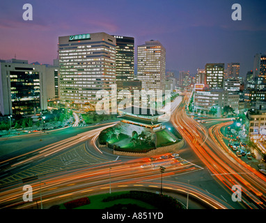 South Korea. Seoul City. Ancient restored South Gate overview at night with busy traffic. Stock Photo