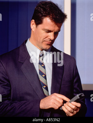 Businessman making a call on his cellphone Stock Photo