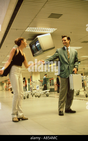 Young couple saying goodbye at airport. Stock Photo