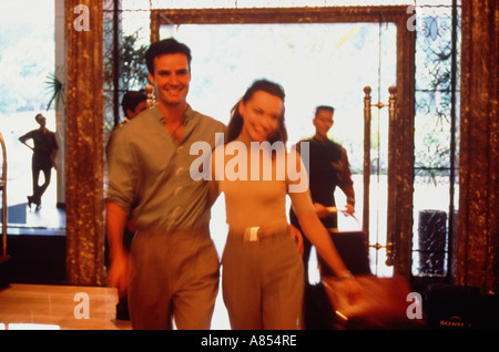 Young couple in hotel lobby. Stock Photo