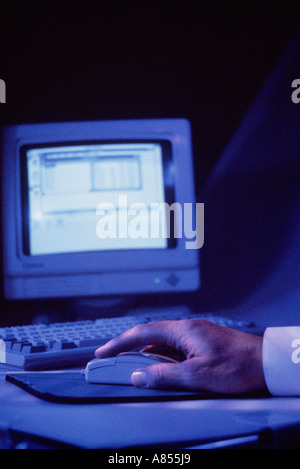 Close up of man's hand operating personal computer. Stock Photo