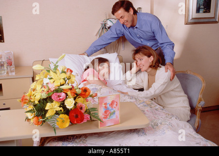 Family visiting their girl child in hospital. Stock Photo