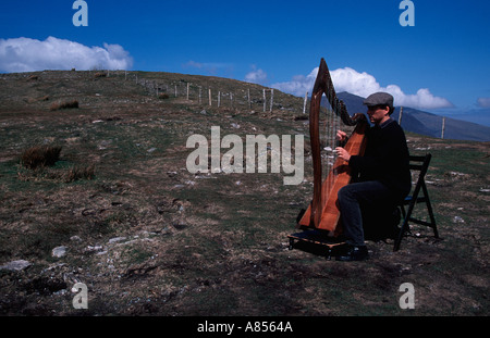 Harp player on a mountain top at Connor Pass Dingle Peninsula Ireland County Kerry Europe Stock Photo