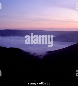 Beautiful sunset and mist in Edale seen from Grindsbrook, above Edale, Peak District National Park, Derbyshire, England, UK. Stock Photo