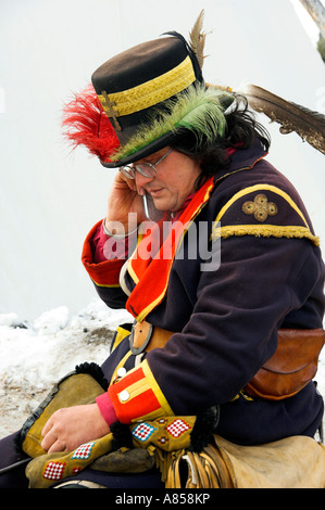 Earl in period costume using a cell phone at the Festival du Voyageur in Winnipeg Manitoba Canada Stock Photo