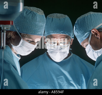 surgeons operating on patient Stock Photo