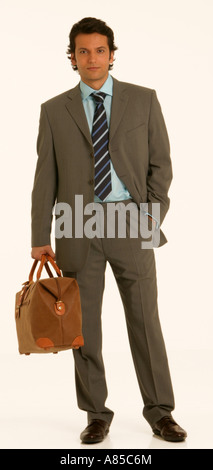 Young man with item of hand baggage Stock Photo