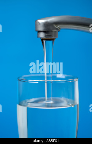 Tap Water Running Into a Glass Stock Photo