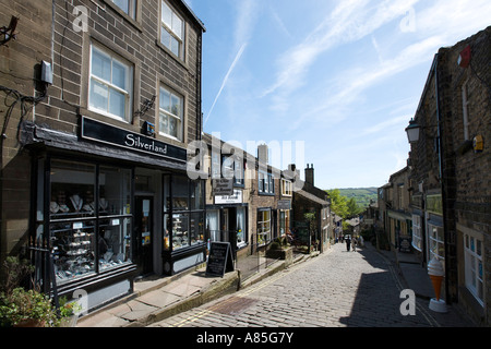 Shops on the main street in the village centre, Haworth, West Yorkshire, England, UK Stock Photo