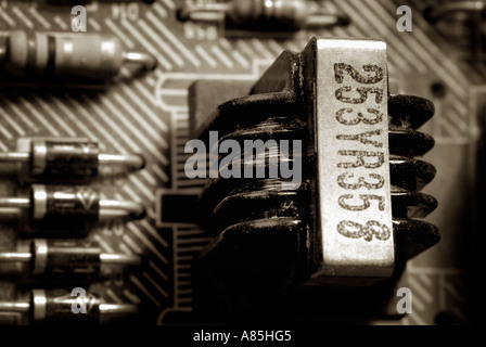 Transformer and Various Electronic Components on a Circuit Board Stock Photo